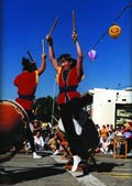 Karen Morita, a member of the group San Jose Taiko, demonstrates the energy of taiko drumming 
during a performance at the San Jose (California) Buddhist Church Betsuin Obon Festival, July 12, 1997. Photo by Michael Olwyler. Courtesy Michael Olwyler and San Jose Taiko.