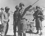Lt. Gen. George S. Patton Jr. strikes a commanding pose, Sicily, July 1943. The U.S. Army’s Inspector General’s Department investigated Patton’s role in the murders of some seventy Axis prisoners of war by American troops in Biscari, Sicily, that month. But no charges were brought against him, and he became an iconic figure in American memory of World War II. 