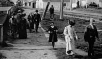 This 1906 photograph shows Hotel Del Monte guests or churchgoers walking past drying fish nets on their way toward the center of Monterey, California, after visiting Booth’s cannery. The fishing industry could be a tourist attraction, but odors from the sardine plants also sparked numerous conflicts between labor and leisure.
