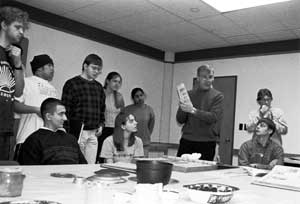 On a recent visit to the Western Reserve Historical Society, John Grabowski shows students in his "Introduction to American History" course how everyday household goods tell the story of American history, revealing the rapid development from a new colony to an industri&shy;alized nation.